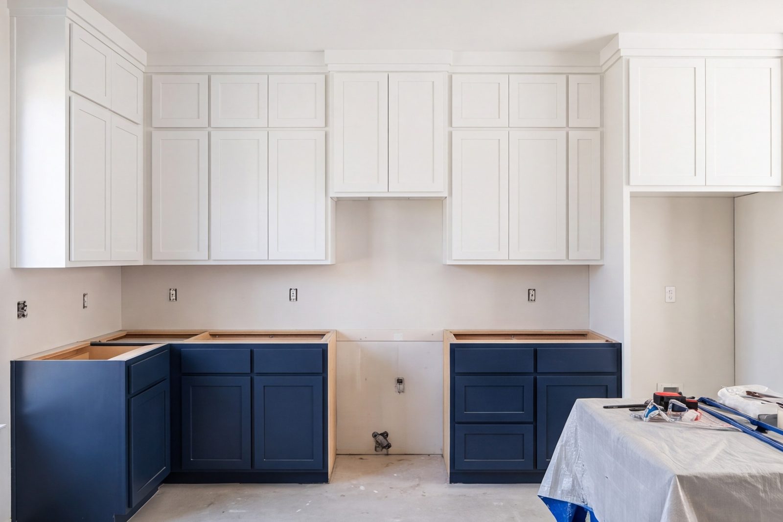 Kitchen mid-build with cabinets set and counters not yet installed