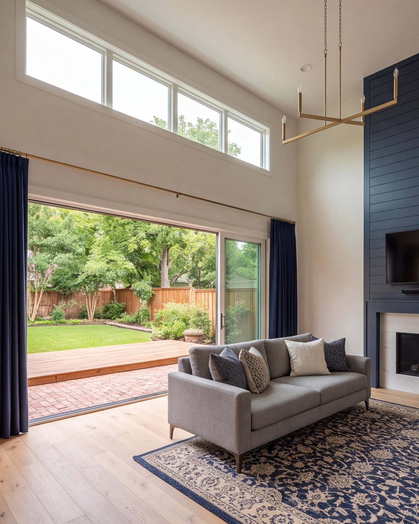 Living room with new wide sliding doors open to the yard